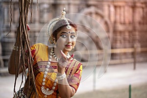 Beautiful indian girl dancer in the posture of Indian dance. Indian classical dance Odissi .