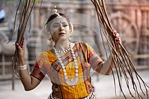 Beautiful indian girl dancer in the posture of Indian dance. Indian classical dance Odissi .