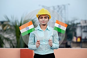 Beautiful Indian Girl in formal were with Indian National Tricolor Flag, Suitable for Independence Day or Republic Day concept