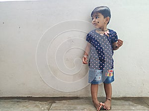 Beautiful Indian Girl Kid Standing and Doing Different Activities like, smiling, dancing, hand movement etc