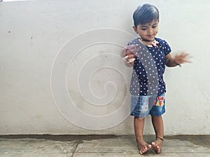 Beautiful Indian Girl Kid Standing and Doing Different Activities like, smiling, dancing, hand movement etc