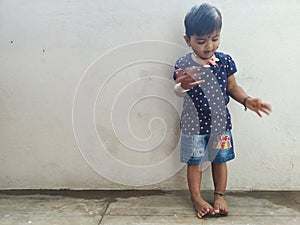 Beautiful Indian Girl Kid Standing and Doing Different Activities like, smiling, dancing, hand movement etc