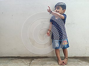 Beautiful Indian Girl Kid Standing and Doing Different Activities like, smiling, dancing, hand movement etc
