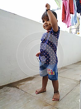 Beautiful Indian Girl Kid Standing and Doing Different Activities like, smiling, dancing, hand movement etc