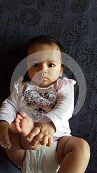 Beautiful indian infant girl looking at camera