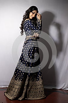 Beautiful indian model wearing a designer lehenga