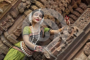 Beautiful indian odissi dancer in the posture of Indian dance . Indian classical dance Odissi