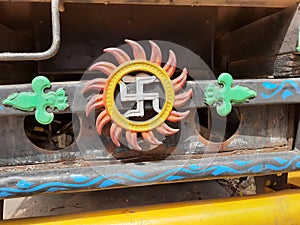 Beautiful Indian Traditional ritual Symbol Swastik and Sun Metal Sign back of the vehicles