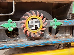 Beautiful Indian Traditional ritual Symbol Swastik and Sun Metal Sign back of the vehicles
