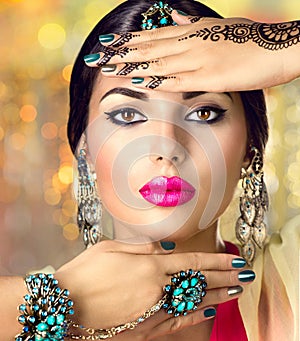 Beautiful Indian woman with black mehndi tattoo. Indian girl