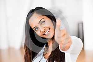 Beautiful Indian woman thumbs up happy smiling