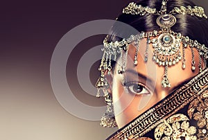 Beautiful Indian women portrait with jewelry.