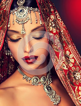 Beautiful Indian women portrait with jewelry. photo