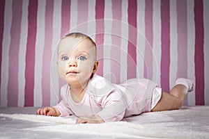 Beautiful infant portrait on colorful background.