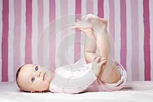 Beautiful infant portrait on colorful background.