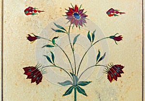 Beautiful inlaid decorative flowers on white marble column of Red Fort in Delhi