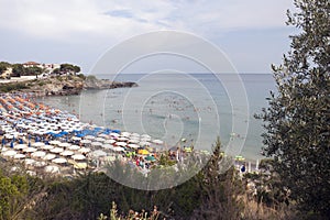 A beautiful inlet with beach and lidos at sunset. Seaside resorts. photo