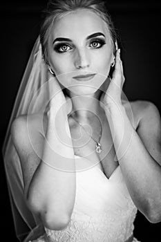 Beautiful innocent blonde bride posing, face closeup