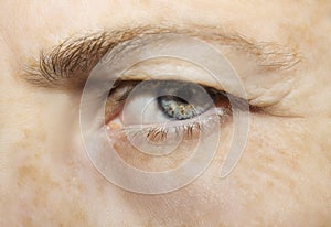 A beautiful insightful look eye. Close up shot. The eye of an elderly woman