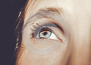 A beautiful insightful look woman`s eye. Close up shot.