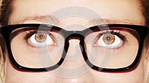 A beautiful insightful look woman`s eye. Woman wearing glasses. Close-up shot