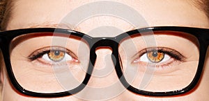 A beautiful insightful look woman`s eye. Woman wearing glasses. Close-up shot