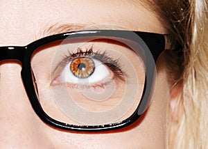 A beautiful insightful look woman`s eye. Woman wearing glasses. Close-up shot