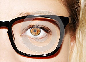 A beautiful insightful look woman`s eye. Woman wearing glasses. Close-up shot