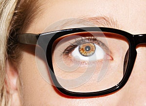 A beautiful insightful look woman`s eye. Woman wearing glasses. Close-up shot