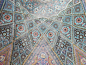 Beautiful Iranian geometric ornaments and designs on dome-shaped roof tiles with multi-colored ornaments Shiraz, Iran