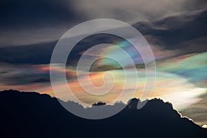 Beautiful Iridescent Pileus cloud in the evening.Rainbow cloud background. photo