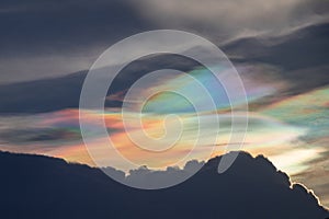 Beautiful Iridescent Pileus cloud in the evening.Rainbow cloud background. photo