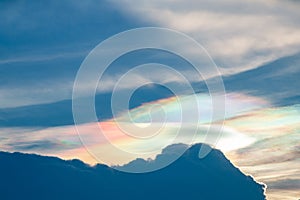 Beautiful Iridescent Pileus cloud in the evening.Rainbow cloud background. photo