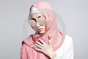 beautiful islamic style young woman. beauty girl in hijab and sunglasses
