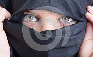 Beautiful islamic woman eyes and face covered by burka photo