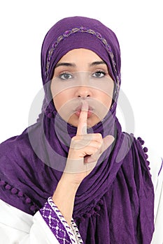 Beautiful islamic woman wearing a hijab asking for silence