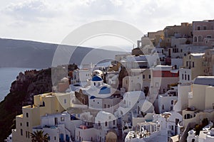 Beautiful island of Santorini, Greece. Traditional white greek houses against the backdrop of the sea. The city of Oia on the