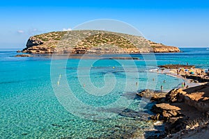 Beautiful island and turquoise waters in Cala Conta, Ibiza Spain