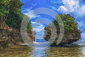 Beautiful island. View of nice tropical beach with palms and stones around. Holiday and vacation concept. Tropical and