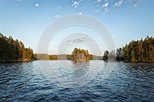 Beautiful islands on the lake at sunset. Isojarvi National park.