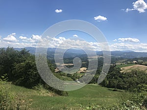 The beautiful Italian countryside with a distant view of the mountains of Northern Italy