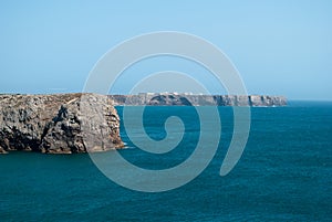 the beautiful jagged coastline on the Atlantic Ocean with a blue sea photo