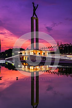 Beautiful Jakarta in colorful sunset, monument reflected on water, Jakarta, Indonesia