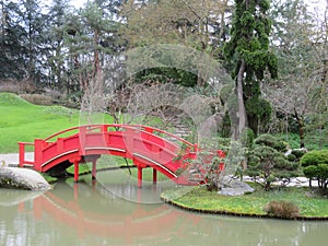 Beautiful Japanese garden in the city of Toulouse with lake and bridge photo