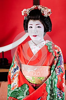 Beautiful Japanese Maiko, Geisha in red costume portrait