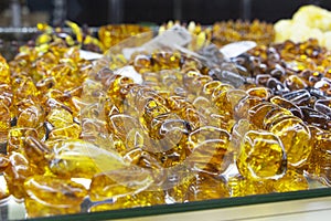 Beautiful jewelry made of natural amber. Jewelry made of amber yellow orange color, close-up.