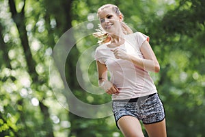 Beautiful jogging woman in nature