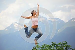 Beautiful joyful woman is jumping. photo