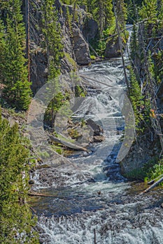 The beautiful Kepler Cascades Waterfall on the Firehole River. Southwestern Yellowstone National Park in the Rocky Mountains, Park
