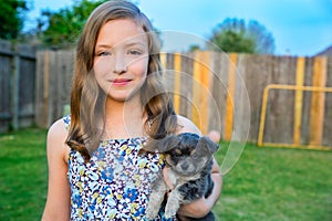 Beautiful kid girl portrait with puppy chihuahua doggy